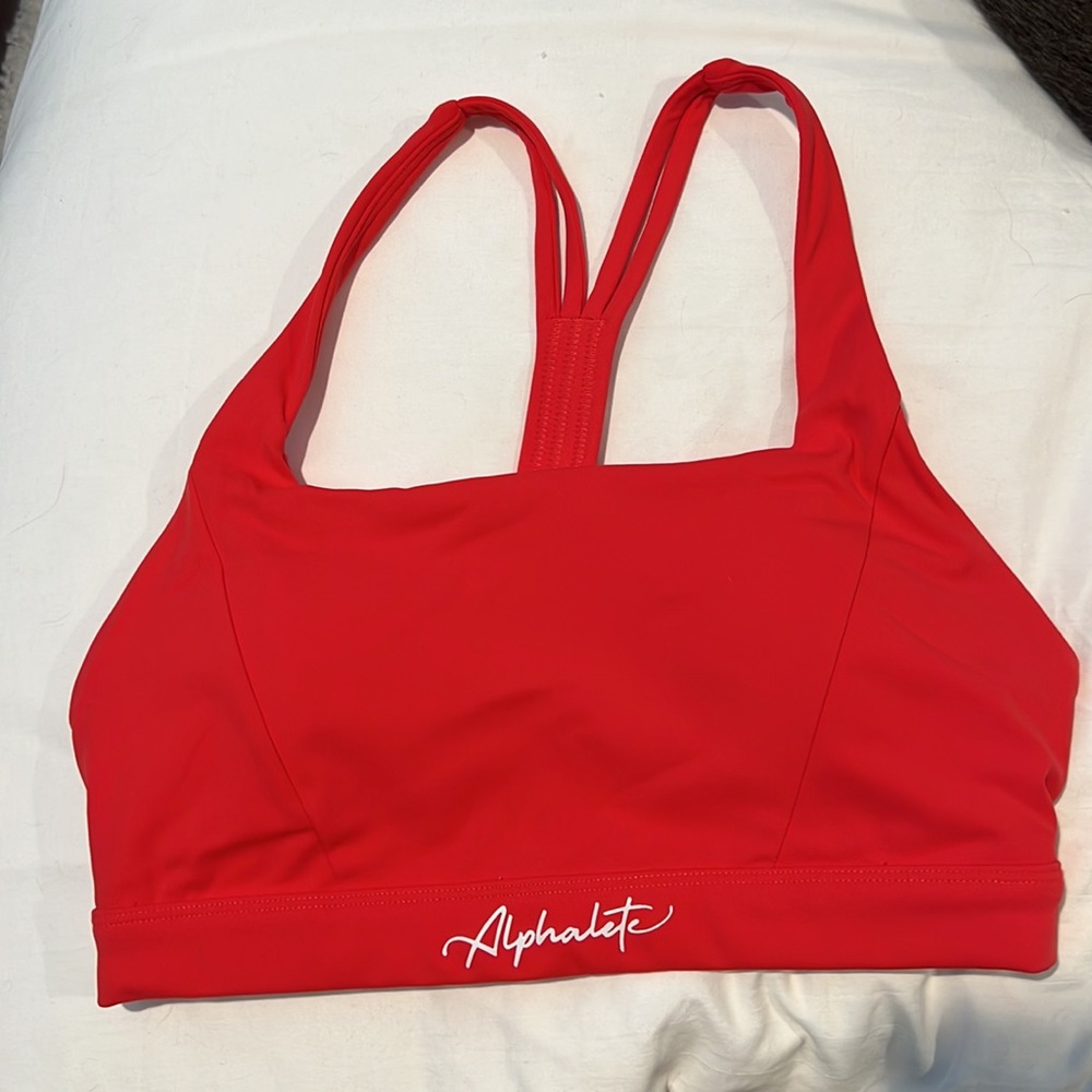 Alphalete Sports Bra size Small, light red color